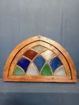 19th C. arched fanlight with coloured glass and curved lattice bars. {H 63cm x W 94cm x D 10cm }.