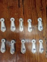 Five pairs of ceramic keyhole covers {H 7cm x W 2cm }.