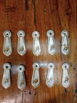 Five pairs of ceramic keyhole covers {H 7cm x W 2cm }.