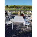 Good quality cast aluminium bamboo style garden table with four chairs. Table {70 cm H x 129 cm W