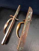 Pair of brass door handles with latches {H 30cm x W 5cm x D 10cm}.