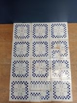 Forty eight ceramic checkered blue and white wall tiles {68 x 51 each tile 8 1/2 sq}.