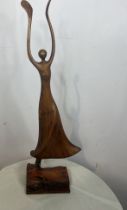 Decorative carved wooden ballerina on base. {H 68cm x W 23cm x D 12cm}.