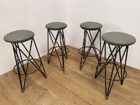 Set of four industrial metal and leather upholstered bar stools {H 79cm x Dia 39cm }.