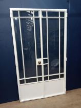 Cast iron double French patio doors in frame with wood and brass door knobs fully glazed {H 198cm