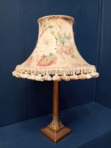 Brass Corinthian column table lamp with cloth shade. {H 50cm x Dia 40cm }.