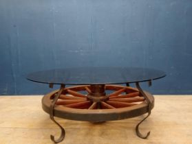 Wagon wheel smoked glass top coffee table {H 48cm x Dia 115cm }.