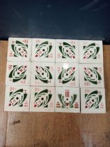 Collection of twelve ceramic green white wall tiles {25 1/2 x 34 each tile 8/12 sq}.