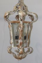 Unusual decorative painted metal acanthus leaf lantern with three branch lights in the centre in the
