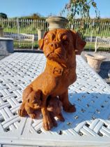 Cast iron model of Pug dog with pups. {30 cm H x 25 cm W x 30 cm D}.