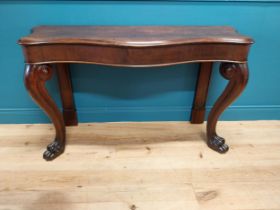 William IV oak serpentine front side table raised on cabriole legs and lions paw feet {80 cm H x 138