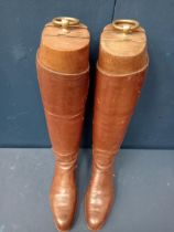 Pair of good quality tan leather riding boots, complete with wooden stays with brass rings Size 9