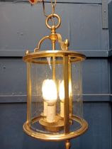 Decorative brass and glass hanging hall lantern. {H 34cm x Dia 16cm }.