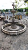 Good quality moulded stone two tiered fountain surmounted with Cherub including surround {Overall