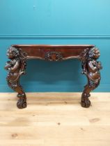 Good quality Italian Victorian mahogany and carved pine console table decorated with cherubs