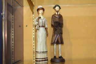 Pair of wooden figurines of a fashionably dressed lady and gentleman in period dress {H 37cm x dia