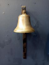 Brass bell and bracket {H 40cm x W 13cm x D 13cm }.