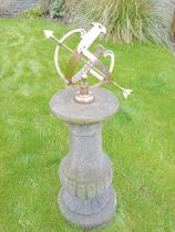 Brass armillary on crushed stone column. {H 93cm x D 25cm }.