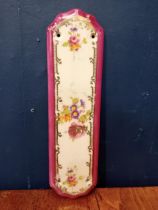 Decorative ceramic finger plate {H 27cm x W 8cm}.