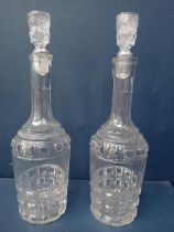 Pair of cut glass decanters. {H 32cm x Dia 8cm }.