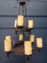 Wrought iron nine branch chandelier with opaque glass shades in the Gothic style. {H 100cm x Dia