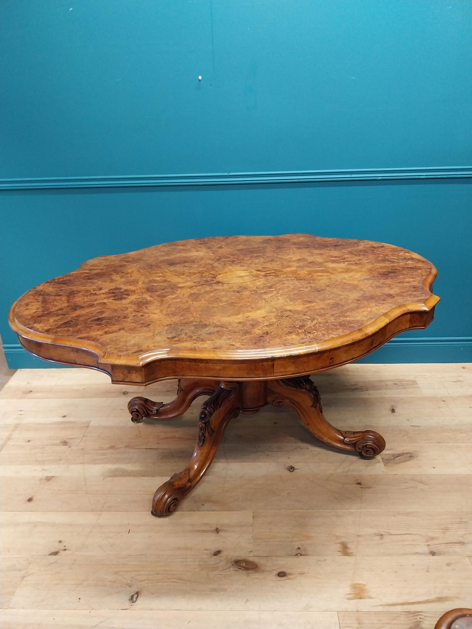 Good quality Victorian burr walnut tilt top centre table raised on turned column and four outswept