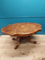 Good quality Victorian burr walnut tilt top centre table raised on turned column and four outswept
