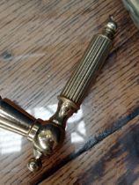 Pair of brass door handles {H 3cm x W 13cm x D 6cm}.