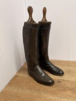 Dark brown leather riding boots with wooden trees. {L 29cm l x H 62cm including stays }.