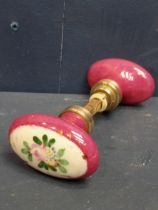 Pair of pink porcelain brass oval door knobs {H 4cm x W 6cm x D 14cm}.