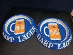 Pair of Harp advertising ashtrays {H 3cm x D 21cm}.