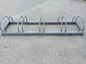 Galvanized bike rack {H 23cm x W 136cm x D 38cm}.