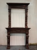 Carved oak fire surround with overmantle {H 314cm x W 167cm x D 55cm Over mantle H 145cm x W 110cm