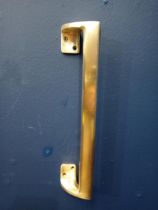 Brass door handle {H 30cm x W 60cm x D 5cm }.