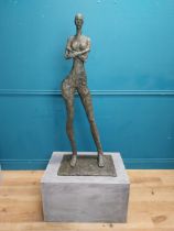Exceptional quality contemporary bronze sculpture of a Lady with arms folded raised on slate base {