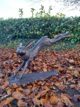 Exceptional quality bronze sculpture of a leaping hare {58cm H x 100cm W x 30cm D}