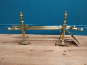 Edwardian brass fire irons and dogs. {34 cm H x 80 cm W x 20 cm D}.