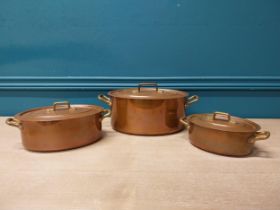 Three copper pots with lids {Smallest:10cm H x 22cm W x 13cm D and Largest: 16cm H x 32cm W x 19cm