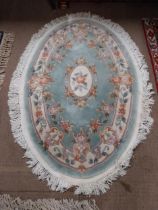 Decorative oval rug. {163 cm H x 114 cm W}