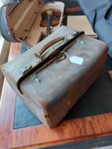 19th. C. leather gentleman's travel case complete with English silver topped cut glass bottles.