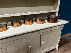 Exceptional quality set of five graduated copper saucepans with metal handles {Largest: 21cm H x