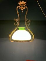 Edwardian gilded brass hanging light fitting with green glass shade {}.