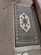 Pair of decorative Persian style rugs.
