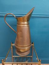 Edwardian brass water jug. {60 cm H x 38 cm W x 22 cm D}.