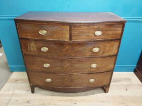 19th C. mahogany bow front chest of drawers with two short drawers over three long drawers raised on