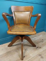 Early 20th C. oak and leather upholstered office chair. {86 cm H x 60 cm W x 53 cm D}.