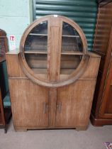 Art Deco oak display cabinet with circular glazed doors. {162 cm H x 112 cm W x 49 cm D}.