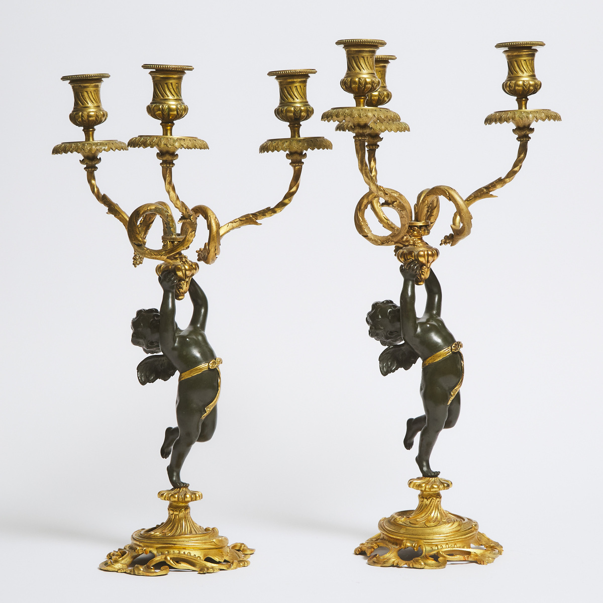 Pair Napoleon III Patinated and Gilt Bronze Figural Three Light Candelabra, early 20th century, heig