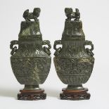 A Pair of Large Spinach Jade Vases and Covers, 19th/20th Century, 晚清/民国 碧玉雕福狮双耳盖瓶一对, height 14 in —
