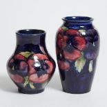 Two Moorcroft Small Pansy Vases, c.1925, height 4.4 in — 11.3 cm; height 3.6 in — 9.1 cm (2 Pieces)